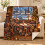 Snowed in with a good book. blanket, on a sofa