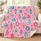Atomic Ornaments blanket, on a sofa