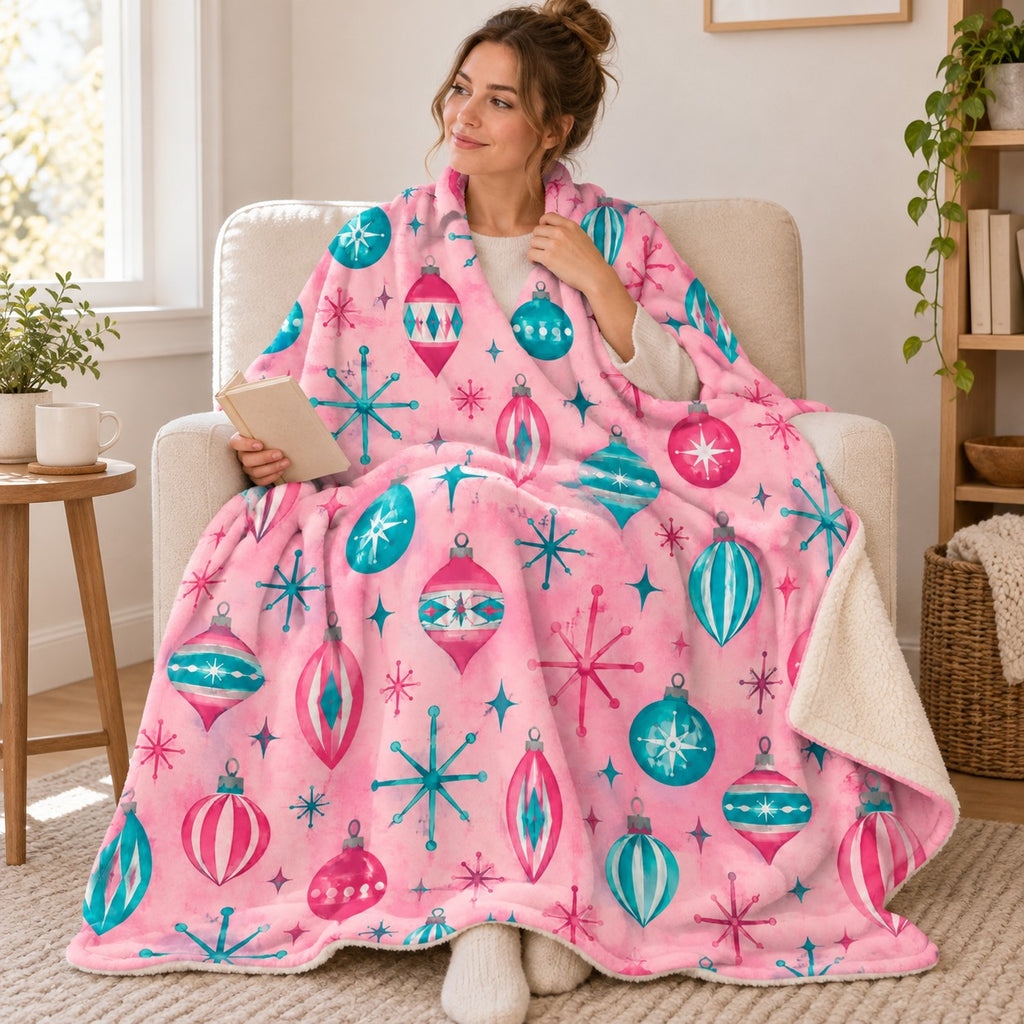 Atomic Ornaments blanket, wrapped around a reader