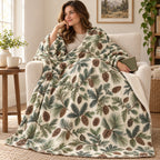 Cream Pinecones blanket, wrapped around a reader