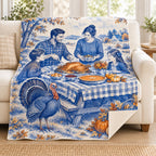 Cobalt Toile Picnic blanket, on a sofa