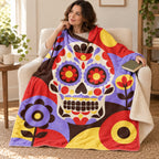 Geometric Calavera blanket, wrapped around a reader