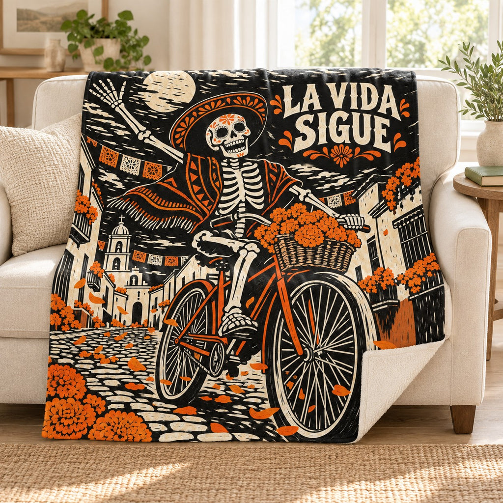 La Vida Sigue blanket, on a sofa
