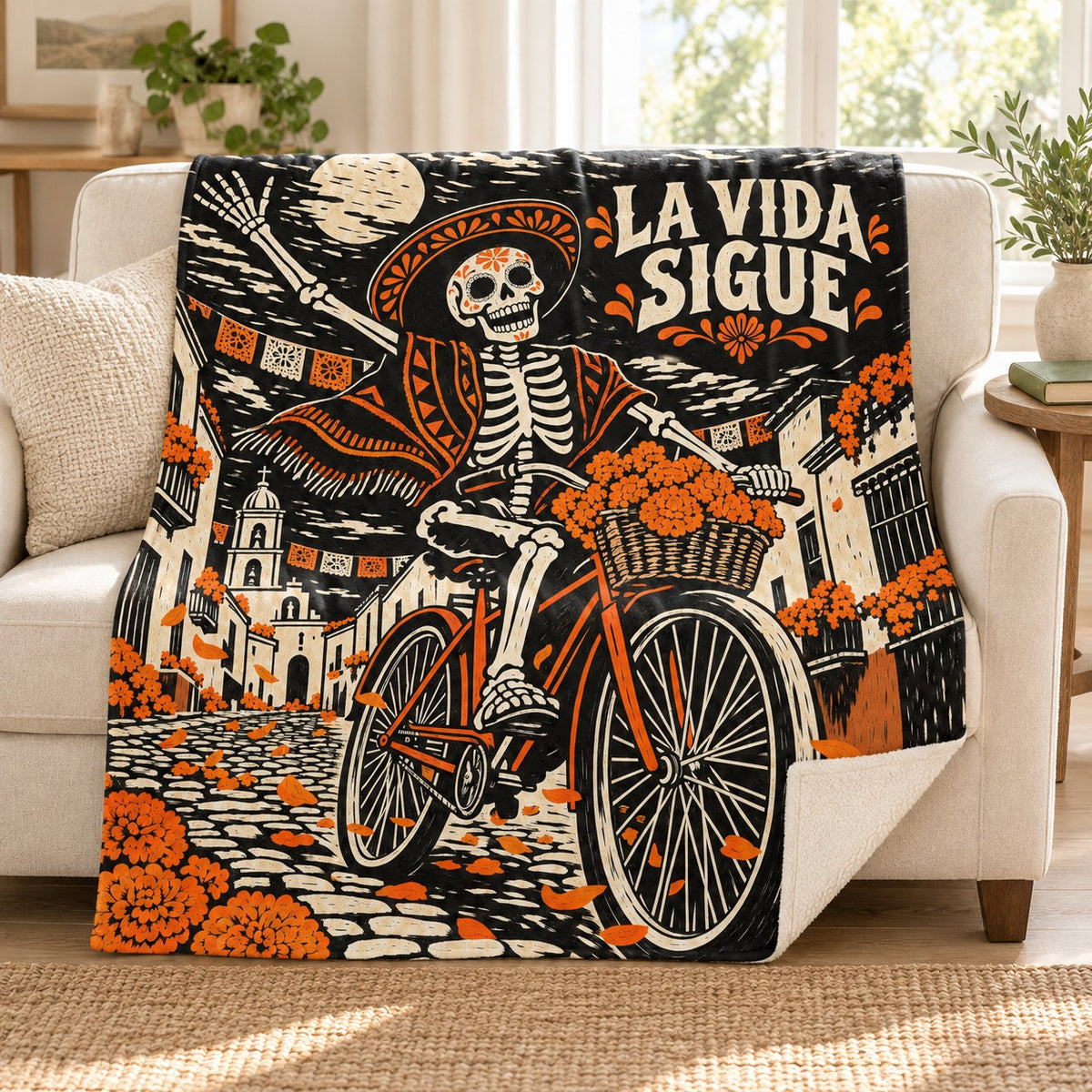 La Vida Sigue blanket, on a sofa