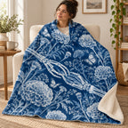 Blueprint Marigolds blanket, wrapped around a reader
