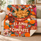 El Amor Se Comparte blanket, on a sofa