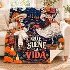 Que Suene la Vida blanket, on a sofa