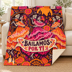 Bailamos por Ti blanket, on a sofa