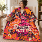 Bailamos por Ti blanket, wrapped around a reader