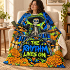 The Rhythm Lives On blanket, wrapped around a reader