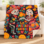 La Amistad Florece blanket, on a sofa