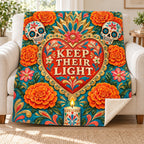 Keep Their Light blanket, on a sofa