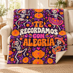 Te Recordamos con Alegría blanket, on a sofa