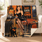 Black Cat Club blanket, on a sofa