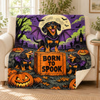 Bat Dog Flight School blanket, on a sofa