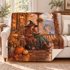 Autumn Porch Pages blanket, on a sofa