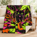 Black Cat Sneaker Club blanket, on a sofa