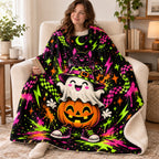 Halloween Neon Totem blanket, wrapped around a reader