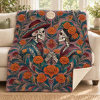 Two Hearts One Garden blanket, on a sofa
