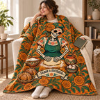 The Family Recipe blanket, wrapped around a reader
