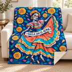 Folklorico Whirl blanket, on a sofa