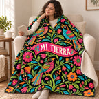 Aves de mi tierra blanket, wrapped around a reader
