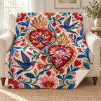Dos corazones blanket, on a sofa