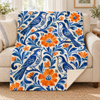Pajaros de ceramica blanket, on a sofa