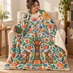 Arbol de los deseos blanket, wrapped around a reader