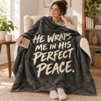 Charcoal Stillness blanket, wrapped around a reader