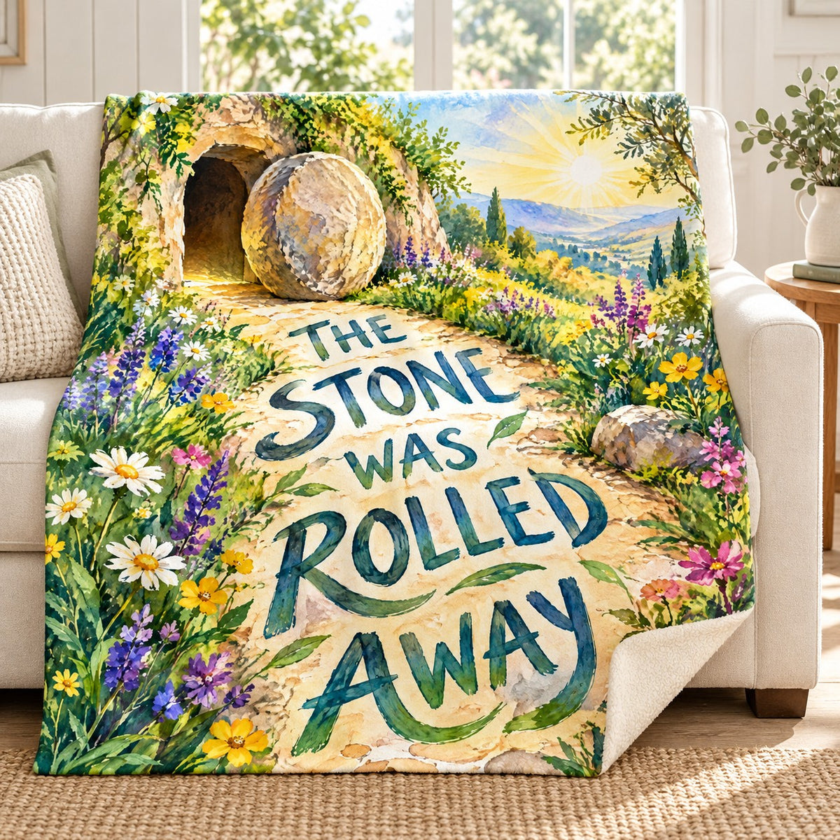 The Stone Was Rolled Away blanket, on a sofa