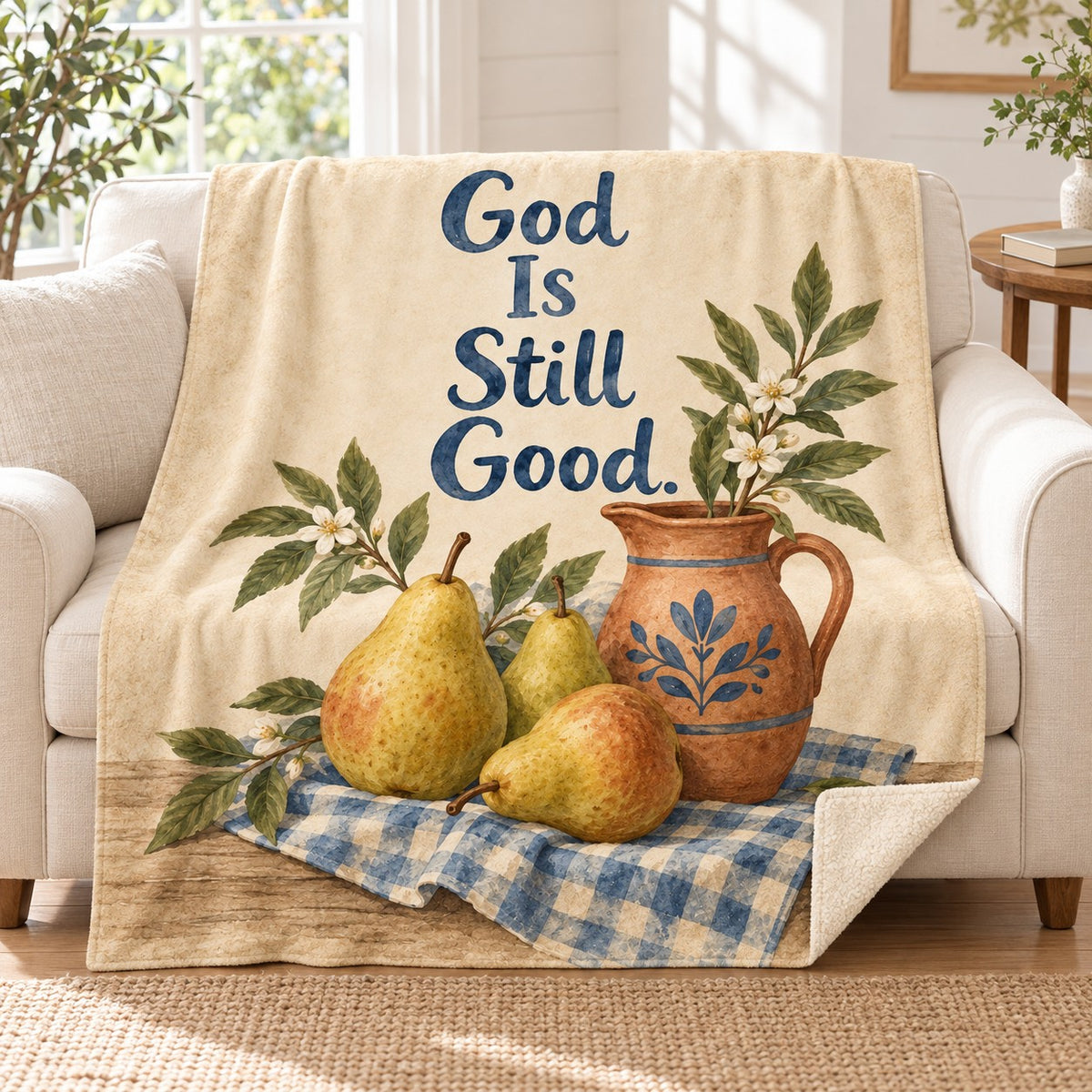 God Is Still Good blanket, on a sofa