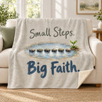Small Steps. Big Faith blanket, on a sofa