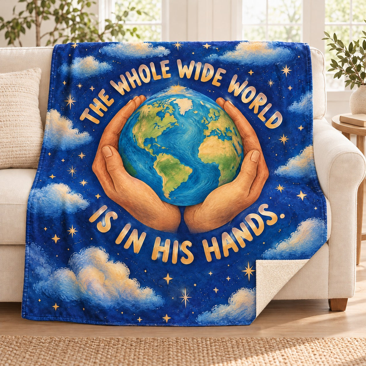 The Whole Wide World Is in His Hands. blanket, on a sofa