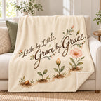 Little by Little, Grace by Grace. blanket, on a sofa