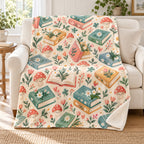 Little Blooming Books blanket, on a sofa
