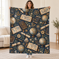 Atlas and Compass blanket, held open