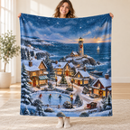 Snowy Lighthouse Village blanket, held open