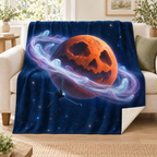 The Ringed Halloween Planet blanket, on a sofa