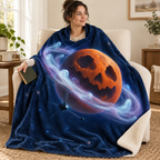 The Ringed Halloween Planet blanket, wrapped around a reader
