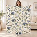 Blue Ink Alphabet blanket, held open