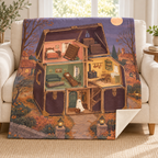 The House That Packs Itself blanket, on a sofa