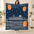 The Lantern Rain blanket, held open