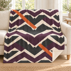 Bat Flight Chevrons blanket, on a sofa