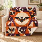 Moon and Bat Tumbler blanket, on a sofa