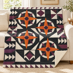 Pumpkin Compass Rose blanket, on a sofa