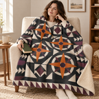Pumpkin Compass Rose blanket, wrapped around a reader