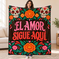 El Amor Sigue Aquí blanket, held open