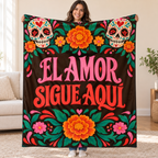 El Amor Sigue Aquí blanket, held open
