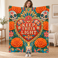 Keep Their Light blanket, held open